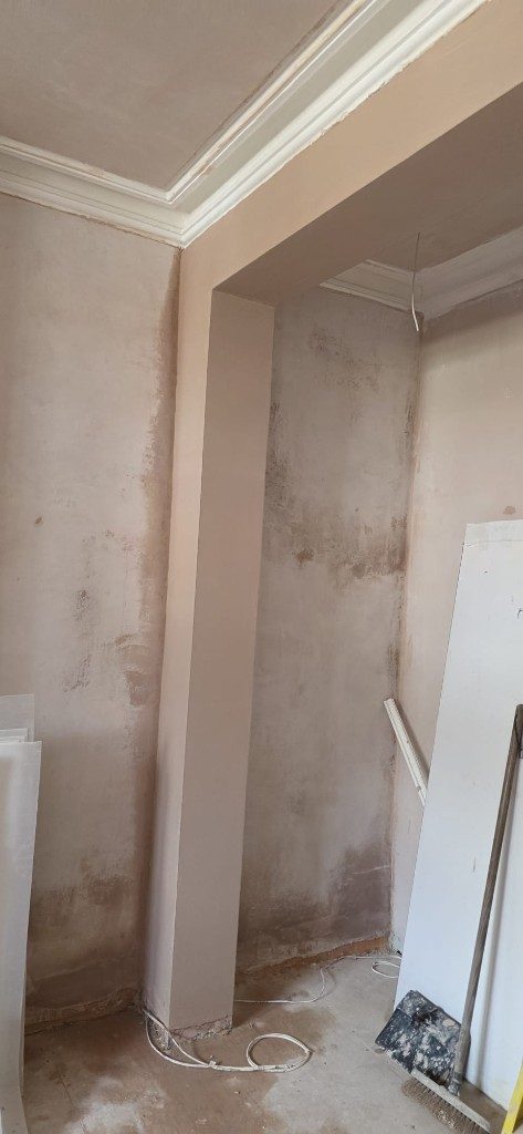Professional plastering on interior walls and structural pillar by Ikveles Construction